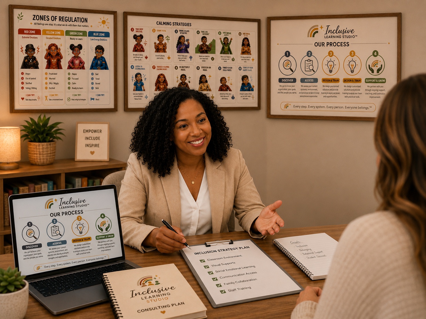 Ms. Maya in a beige blazer seated at a consulting table with Inclusive Learning Studio materials — process infographic on a laptop, Inclusion Strategy Plan clipboard, Consulting Plan notebook, and framed Zones of Regulation and Calming Strategies posters behind her
